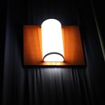 Rustic Elegance: Wooden Hollow Carved Wall Lamp